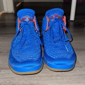 Air Jordan’s “Why Not?” blue with fire orange accents. Size 6Y (or 6M, or 7.5W)
